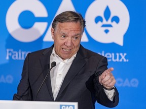 Quebec Premier François Legault answers questions at event introducing Pascale Déry as the CAQ candidate in Repentigny July 5, 2022.