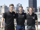 Potential top picks for the coming NHL draft, stand in front of the city's skyline on Wednesday July 6, 2022. Juraj Slafkovsky, from left, Shane Wright, Logan Cooley.