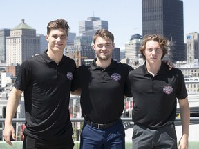 Potential top picks for the upcoming NHL draft, standing in front of the city skyline on Wednesday, July 6, 2022. Juraj Slafkovsky, from left, Shane Wright, Logan Cooley.
