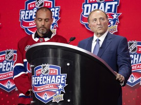 NHL Commissioner Gary Bettman is booed by Montreal fans as he delivers the opening remarks at the NHL Draft in Montreal on Thursday, July 7, 2022. Martin Lafleur, son of Guy Lafleur, looks on.