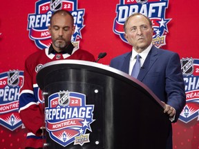 NHL commissioner Gary Bettman is booed by Montreal fans as he delivers the opening remarks at the NHL Draft in Montreal on Thursday, July 7, 2022. Martin Lafleur, son of Guy Lafleur, looks on.