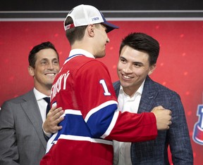 Montreal Canadiens' Nick Suzuki greets the team's first draft choice, Juraj Slafkovsky, during the NHL Draft in Montreal on Thursday, July 7, 2022.