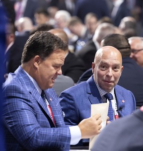 Jeff Gorton, executive vice-president, Hockey Operations, left, and GM Kent Hughes chat during the NHL Draft in Montreal on Thursday, July 7, 2022.