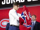 Geoff Molson greets Juraj Slafkovsky as the Montreal Canadiens' first draft choice during the NHL Draft in Montreal on Thursday, July 7, 2022.