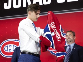 Geoff Molson greets Juraj Slafkovsky as the Montreal Canadiens 1st draft choice during the NHL Draft in Montreal on Thursday, July 7, 2022.