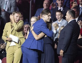Juraj Slafkovsky and his family react as the Montreal Canadiens pick Slafkovsky as their 1st draft choice during the NHL Draft in Montreal on Thursday, July 7, 2022.