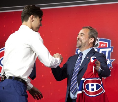 Geoff Molson greets Juraj Slafkovsky as the Montreal Canadiens 1st draft choice during the NHL Draft in Montreal on Thursday, July 7, 2022.