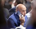 Montreal Canadiens GM Kent Hughes speaks on the phone as he follows the NHL Draft in Montreal on Thursday, July 7, 2022.