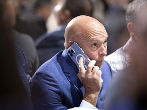 Montreal Canadiens GM Kent Hughes speaks on the phone as he follows the NHL Draft in Montreal on Thursday, July 7, 2022.