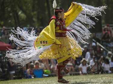Niimin Hupfield, from the Temagami First Nation, near North Bay, Ont., takes part in a fancy shawl dance at the 30th edition of the Echoes of a Proud Nation Pow-Wow in Kahnawake on Sunday, July 10, 2022.
