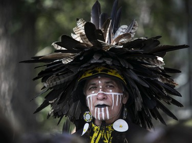 Sam Ojeda, originally from Mayo Yoreme First Nation in Mexico, but now a resident of Kahnawake, watches other dancers from the sidelines 30th edition of the Echoes of a Proud Nation Pow-Wow in Kahnawake on Sunday, July 10, 2022.