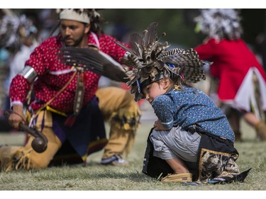 Ryson Thompson takes part in a sneak-up dance at the 30th edition of the Echoes of a Proud Nation Pow-Wow in Kahnawake on Sunday, July 10, 2022.