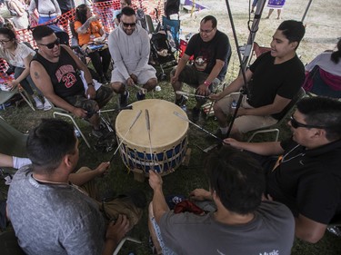 A group of drummers called Black Bear from the Manawan First Nations reserve play at the 30th edition of the Echoes of a Proud Nation Pow-Wow in Kahnawake on Sunday, July 10, 2022.