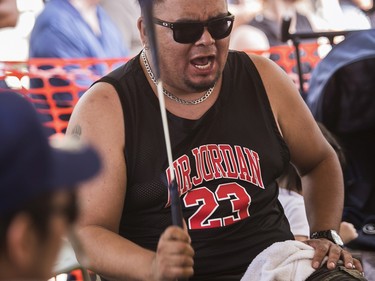 Gordie Moer, part of a group of drummers called Black Bear from the Manawan First Nations reserve, play at the 30th edition of the Echoes of a Proud Nation Pow-Wow in Kahnawake on Sunday, July 10, 2022.