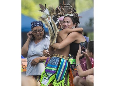 People attend the 30th edition of the Echoes of a Proud Nation Pow-Wow in Kahnawake on Sunday, July 10, 2022.