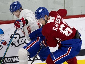 Juraj Slafkovsky and Ryan Hopkins battle for position during Canadiens evaluation camp at the Bell Sports Complex in Brossard.