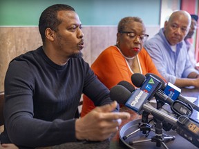 Greenz Restaurant owner Leon Charles, Spice Island Cultural Day Association of Quebec vice- president Gemma Raeburn-Baynes and Fo Niemi of CRARR address reporters at the restaurant in Lachine on Wednesday.
