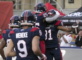 Montreal Alouettes's Tyson Philpot (81) celebrates his touchdown with teammates during first-half CFL action in Montreal on Thursday, July 14, 2022.