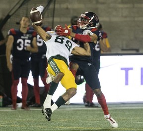 Montreal Alouettes's Wesley Sutton (37) gets pass interference on Edmonton Elks's Kenny Lawler (89) during second-half CFL action in Montreal on Thursday, July 14, 2022.