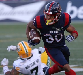 Montreal Alouettes's Chandler Worthy (30) pulls away from Edmonton Elks's Tre Watson (7) during first-half CFL action in Montreal on Thursday July 14, 2022.