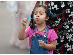 A girl celebrates celebrates Eid-Al-Adha in Saskatoon last year. "While the religious essence of the holiday remains unchanged, there's no reason not to North Americanize how we enjoy and honour it," Fariha Naqvi-Mohamad writes.