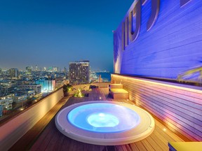 The Carlton’s rooftop whirlpool offers a nighttime view of Tel Aviv.