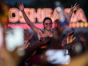 Enjoying Burna Boy's performance during Day 2 of the Osheaga festival at Parc Jean-Drapeau on July 30, 2022.