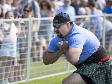 Josh Goldthorpe celebrates tossing in the weight over bar at 15 feet high, during the Montreal Highland games in Montreal on Sunday, July 31, 2022.