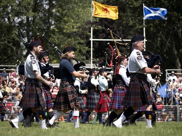 The RCMP Pipe Band takes part in the opening ceremonies of the Montreal Highland games in Montreal on Sunday, July 31, 2022.
