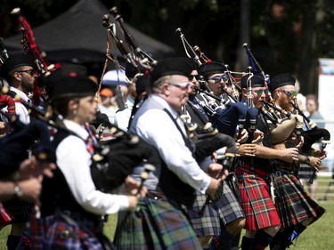The MacMillian Pipe Band takes part in the opening ceremonies at the Montreal Highland games in Montreal on Sunday, July 31, 2022.