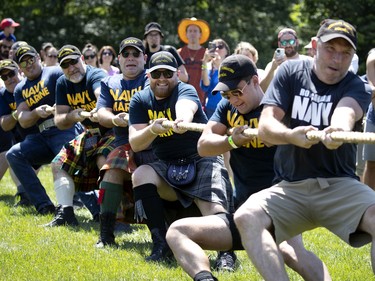 The Navy team from HMCS Donnacona beats the infantry team from the Black Watch in the first round of the tug of war during the Montreal Highland games in Montreal on Sunday, July 31, 2022.