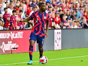 Shaq Moore #2 of the United States dribbles the ball in the first half against Panama at Exploria Stadium on March 27, 2022 in Orlando, Fla.