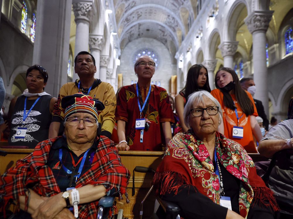 In the pews at a mass with Pope Francis at the Ste-Anne-de-Beaupré basilica on Thursday, July 28, 2022.