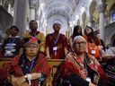 In the pews at a mass with Pope Francis at the Ste-Anne-de-Beaupré basilica on Thursday, July 28, 2022.