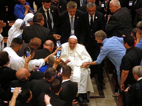 Pope Francis, centre, departs after presiding over an evening prayer service at the Basilique-cathedral Notre-Dame in Quebec City on July 28.