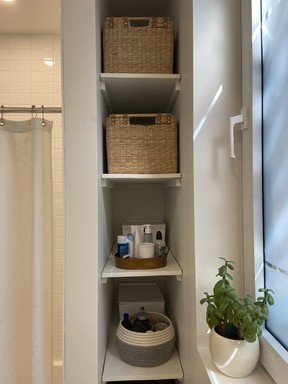 For this Outremont bathroom Krausz added shelving near the bathtub for wicker baskets, which warm up the clean and minimal space. PHOTO COURTESY ANNIKA KRAUSZ INTERIORS