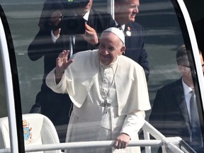 Pope Francis arrives for an open-air mass in the Popemobile at Commonwealth Stadium in Edmonton on July 26, 2022.