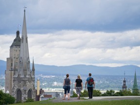 A group of people walk atop the walls of the Citadelle in Quebec City on July 26, 2022. Pope Francis is scheduled to speak at the Citadelle on July 27, 2022.