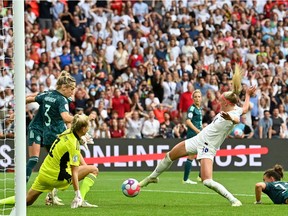 England's striker Chloe Kelly scores her team second goal during the UEFA Women's Euro 2022 final football match between England and Germany at the Wembley stadium, in London.