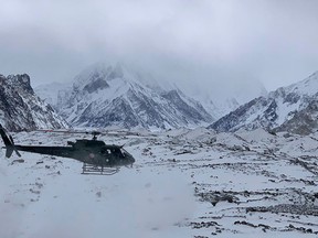 This handout photo taken on Jan. 16, 2021 and released by Seven Summit Treks, shows a Pakistani army helicopter flying over the base camp of Mt. K2, which is the second-highest mountain in the world, in the Gilgit-Baltistan region of northern Pakistan.
