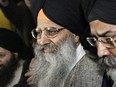 Ripudaman Singh Malik (centre) leaves B.C. Supreme Court in Vancouver, B.C. with his supporters after he was found not guilty in the bombing of an Air India flight 182 in 1985, Wednesday March 16, 2005.