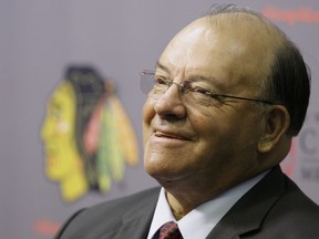 Eleven-time Stanley Cup champion Scotty Bowman answers questions as he is introduced as the new senior advisor for hockey operations for the Chicago Blackhawks on Thursday, July 31, 2008. Scotty Bowman says he no longer works for the Chicago Blackhawks as of July 1, 2022. The Hockey Hall of Famer who won the Stanley Cup nine times as a coach had been a senior hockey operations adviser since 2008.