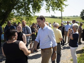 Prime Minister Justin Trudeau greets locals after making an announcement at Fraser Valley Farm in Hardwood Lands, N.S. on Thursday, July 21, 2022.