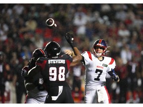 Montreal Alouettes quarterback Trevor Harris makes a pass for a two-point conversion against the Redblacks in Ottawa on July 21, 2022.