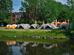 Tents are set up near the Lachine Canal for a camping activity in 2014.