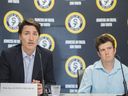 Prime Minister Justin Trudeau, left, with Eric Kingsley of the Montreal-based youth group Sun Youth, speaks during a roundtable discussion with victims and survivors of violent crime in Montreal, Monday, July 11, 2022.