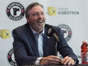 Hall of Fame goaltender Patrick Roy smiles as he announces his comeback with the Quebec Remparts of the QJMHL, Thursday, April 26, 2018 at the Videotron centre in Quebec City.