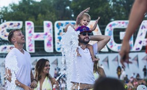 May McNaughton and dad Morgan enjoy the sounds on Day 1 of the Osheaga festival at Parc Jean-Drapeau in Montreal Friday, July 29, 2022.