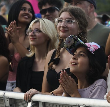 Eleanor Boerr (right), enjoys the performance of Girl in Red on day 3 of the Osheaga festival at Parc Jean-Drapeau on July 31, 2022.