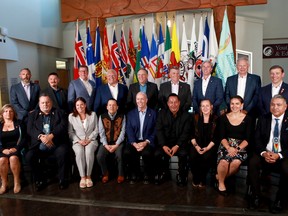 Premiers (back row L-R), Sandy Silver (Yukon), P.J. Akeeagok, (Nunavut), Scott Moe (SK), Doug Ford (Ont),Francois Legault (Que), Dennis King (PEI), Tim Houston (NS), Blaine Higgs (NB), Andrew Furey (NL and Labrador) and (front row L-R), President of Institute for the advancement of Aboriginal Women Lisa Weber, National Chief of Congress of Aboriginal Peoples Elmer St. Pierre,  Heather Stefanson (MB), Songhees Nation Chief Ron Sam, John Horgan (BC), Esquimalt Nation Chief Rob Thomas, Caroline Cochrane (NWT), Cassidy Caron (Metis National Council) and Terry Teegee (Assembly of First Nations) gather for a family photo during the summer meeting of the Canada's Premiers at the Songhees Wellness Centre in Victoria, B.C., on Monday, July 11, 2022